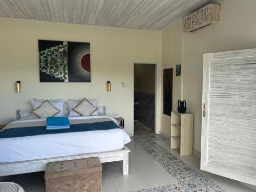 Postel nebo postele na pokoji v ubytování Nusa View - Oceanfront Rentals
