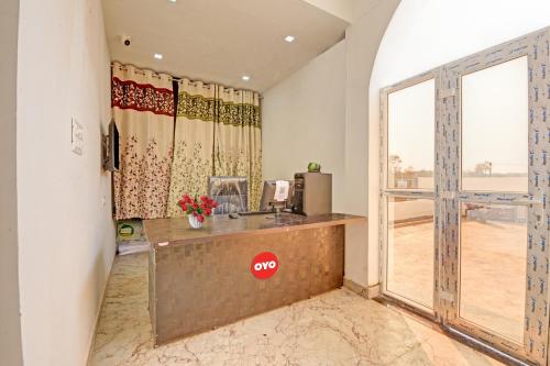 an office with a desk in a room with a window at Hotel O The Heart Residency in Rāmgarh