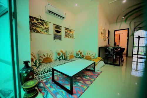a room with a table in the middle of a room at 3Bhk Villa with Swimming Pool I Nyra Homestay in Jaipur