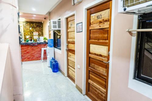 a door leading into a kitchen with a counter at JRJA Suites 2 fronting St Mary's College Tagum in Tagum