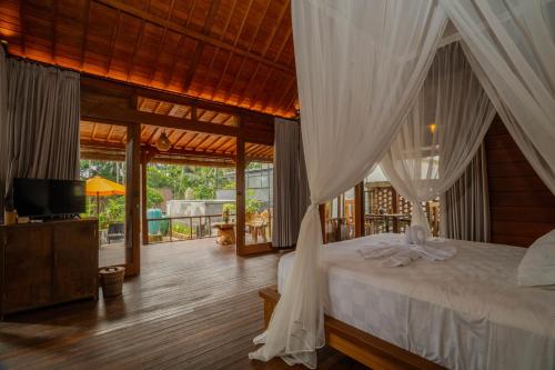 Ένα ή περισσότερα κρεβάτια σε δωμάτιο στο Tegale Ubud Home