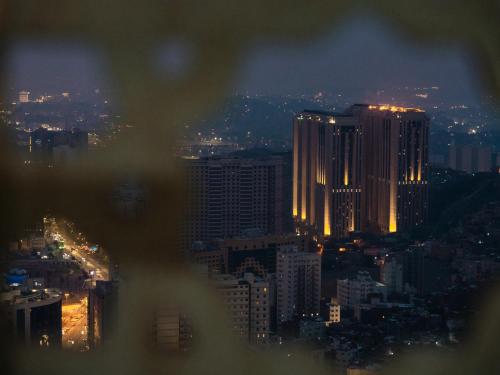 a view of a city skyline at night at Pullman ZamZam Makkah in Makkah