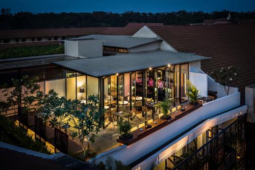 an aerial view of a house at night at The Aviary Hotel in Siem Reap