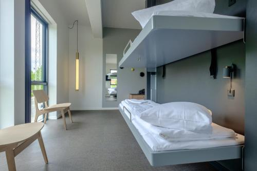 
a bedroom with a bed and a window at Zleep Hotel Copenhagen Airport in Copenhagen
