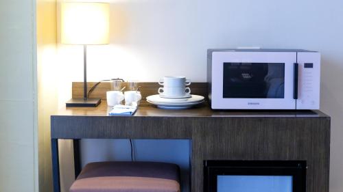 Телевизор и/или развлекательный центр в Stay Near Private Beach in Boracay