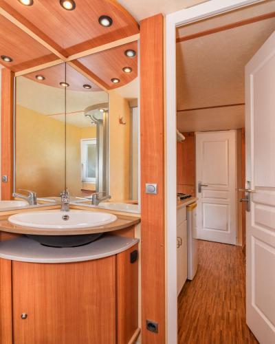 a bathroom with a sink and a mirror at Camping Europa in Marina di Massa