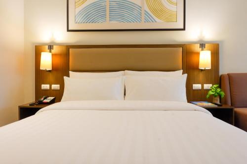 Кровать или кровати в номере Stay Near Private Beach in Boracay