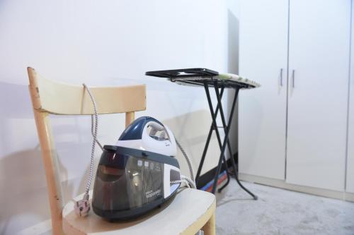 a helmet sitting on a chair next to a desk at Maison Lepore in Vietri di Potenza