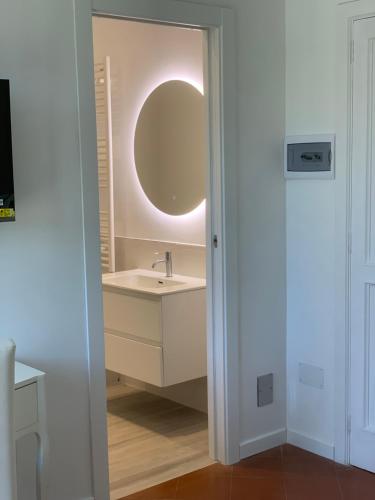 a bathroom with a sink and a mirror at B&B Madreperla in Gallipoli