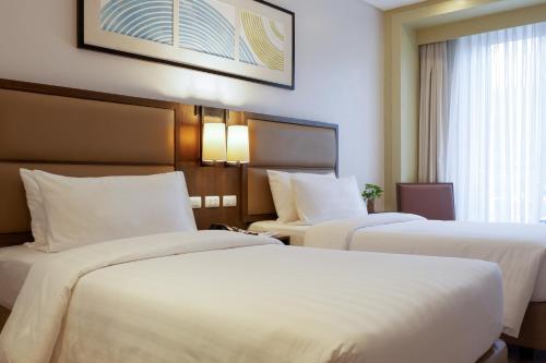 Кровать или кровати в номере Stay Near Private Beach in Boracay