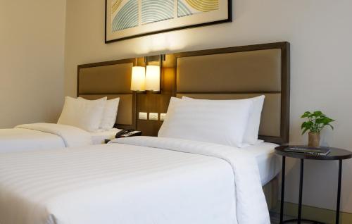 Кровать или кровати в номере Stay Near Private Beach in Boracay