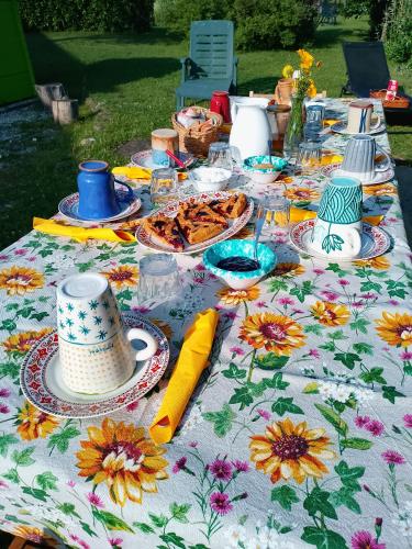 a table with a table cloth with flowers on it at Agriturismo la Fattoria al Crocefisso in Pieve Fosciana