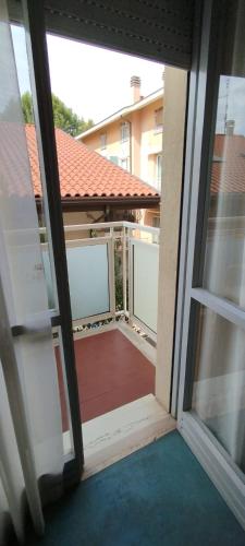 an open door to a balcony with a view at Hotel Acerboli in Rimini