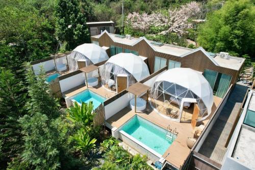 an aerial view of a house with three domes at The X10 Nordic Tent and Glamping Pool Villa Khaoyai เขาใหญ่ - SHA Certified in Ban Thung Sawang
