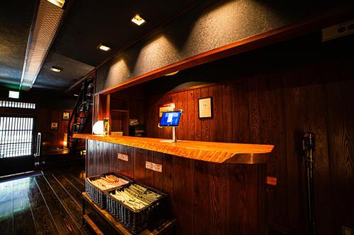 a bar in a boat with a television on it at Private Onsen 泊 - Park - Tsuetate in Oguni