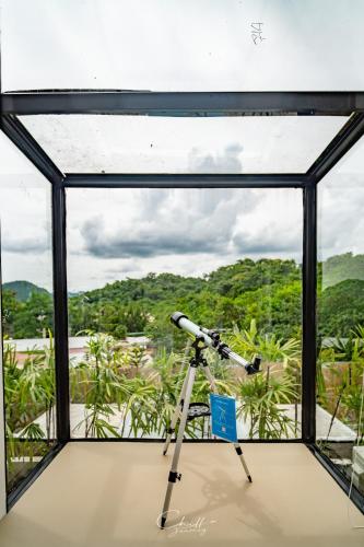 a telescope in a room with a view at The X10 Nordic Tent and Glamping Pool Villa Khaoyai เขาใหญ่ - SHA Certified in Ban Thung Sawang