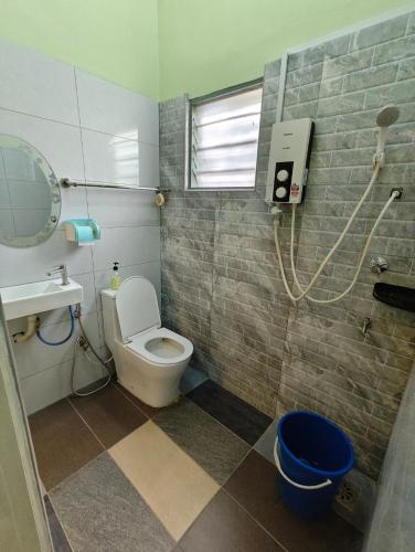a bathroom with a toilet and a shower at Homestay Klang in Klang