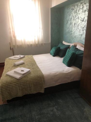 a bedroom with a large bed with a tray on it at Heart apartments in Sarajevo