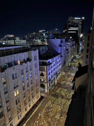 a view of the city at night at Luxury Residence at Taj Cape Town - Top Corner Apartment with Balcony in Cape Town