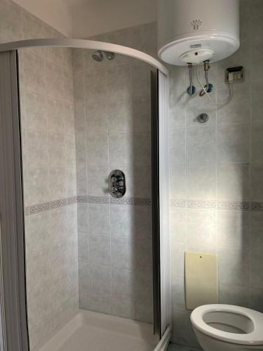 a bathroom with a shower and a toilet at Flat 23 Vico Equense centro in Vico Equense