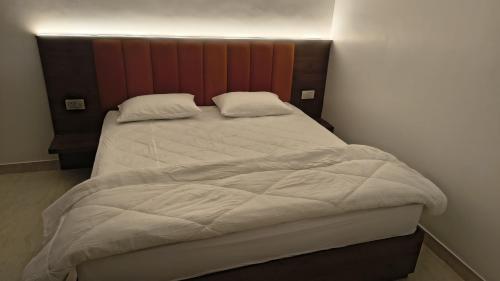 Ένα ή περισσότερα κρεβάτια σε δωμάτιο στο Aarambh Home Stay