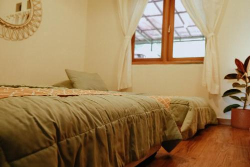 Ένα ή περισσότερα κρεβάτια σε δωμάτιο στο Villa Teras Makati 4BR near Curug Nangka
