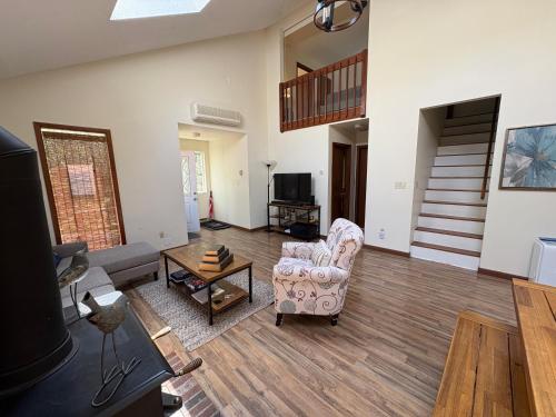 a living room with a couch and a chair at Ash Cottage in Poconos near Camelback & Kalahari in Long Pond
