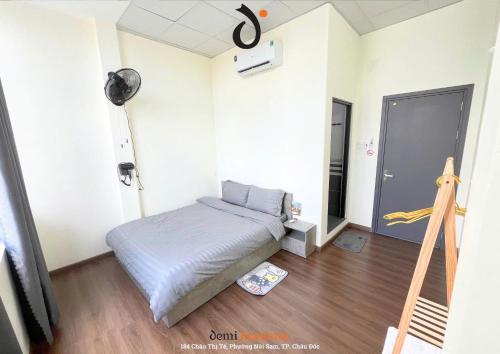Ένα ή περισσότερα κρεβάτια σε δωμάτιο στο DeMi Homestay 2 - Châu Đốc