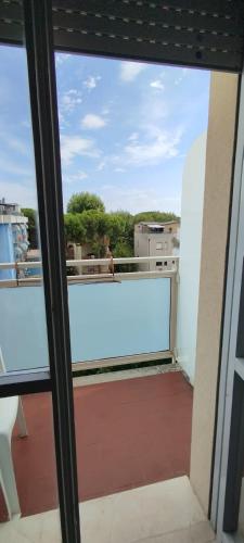 a view from a window of a balcony at Hotel Acerboli in Rimini