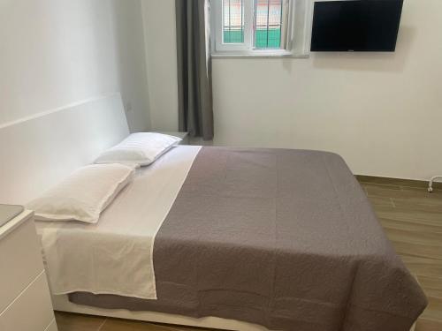 Una cama o camas en una habitación de Casa Isabel parco di monza
