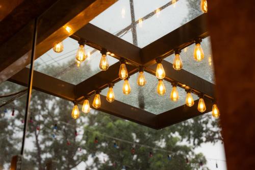 a bunch of lights hanging from a ceiling at The Scenic Hotel in Phnom Penh