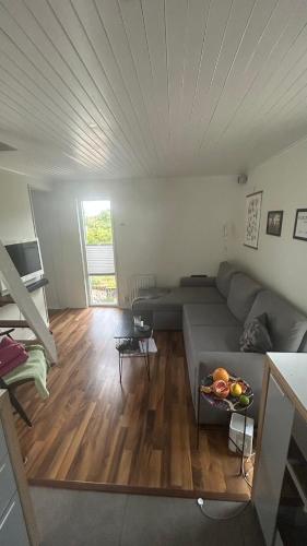 a living room with a couch and a table at Strandstugan in Halmstad