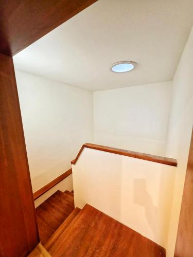 a room with a staircase with a light on the ceiling at Marions Stay in Vrbov