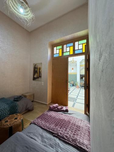 Postel nebo postele na pokoji v ubytování Riad Dar Fassi