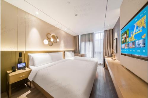 Postel nebo postele na pokoji v ubytování Orange Hotel, Beijing Daxing Biomedicine Base