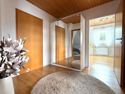 a room with a large mirror and a large rug at Gemütliche Ferienwohnung in Ennepetal