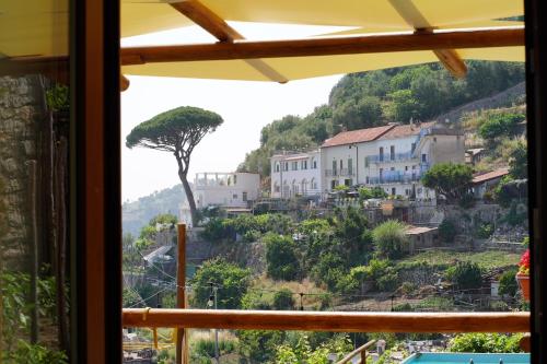 a view of a town from a window at San Giacomo Relais in Furore