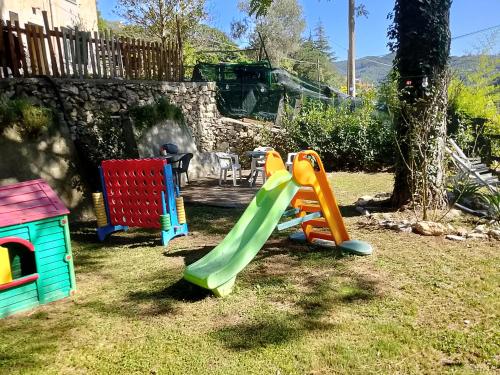 a group of childrens playground equipment in a yard at SOTTO LA ROCCA in Finale Ligure