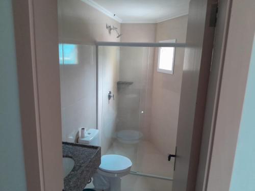a bathroom with a shower and a toilet and a sink at Hotel Du Rastro in Louro Müller