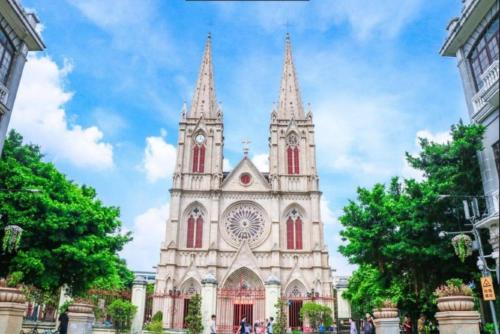 a large cathedral with two towers on a cloudy sky at Yimimi Apartment - Guangzhou 13th Line Yide Road Metro Station in Guangzhou