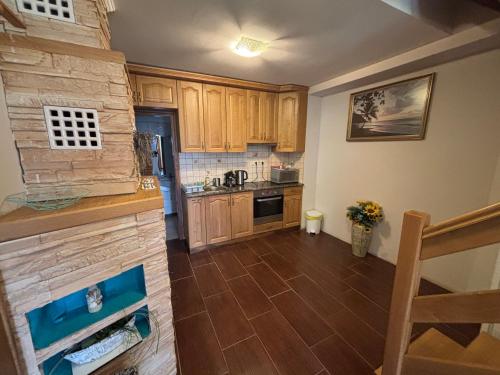 Η κουζίνα ή μικρή κουζίνα στο Nemere Apartmans