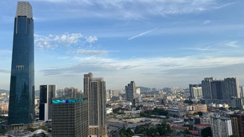 a view of a city with tall buildings at Axon Residence Near Fehrenheit Bukit Bintang in Kuala Lumpur