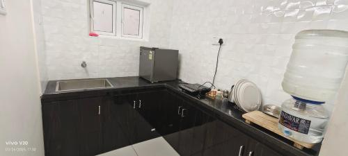 Η κουζίνα ή μικρή κουζίνα στο AGI Elite stay Srirangam