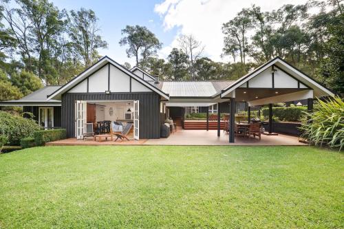a home with a large patio and grass at Best of Yarra Valley and Kinglake National Park 