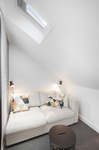 a living room with a white couch and a table at Best of Yarra Valley and Kinglake National Park 
