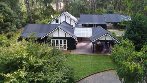 an aerial view of a house in the woods at Best of Yarra Valley and Kinglake National Park 