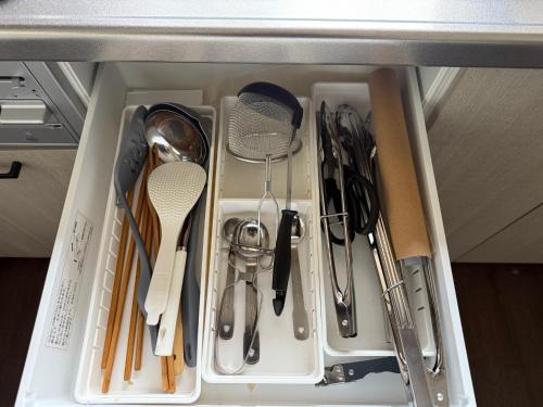 a drawer full of kitchen utensils in a cabinet at Potontoikkenya Kuraoka - Vacation STAY 23373v in Mamihara
