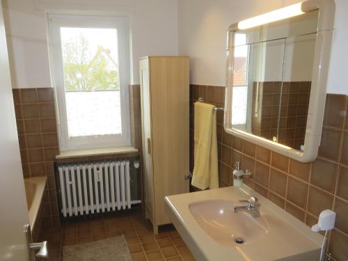 Ένα μπάνιο στο Ferienwohnung Kampstrasse 6