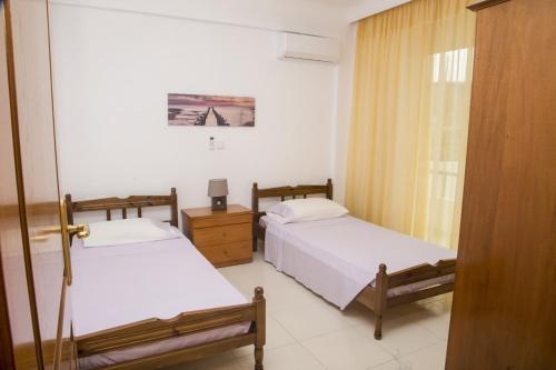 Кровать или кровати в номере Aggeli Village House
