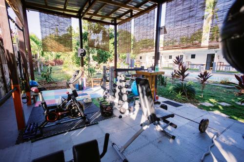 a room with a gym with some exercise equipment in it at Selectum Mangrove Resort in Panglao